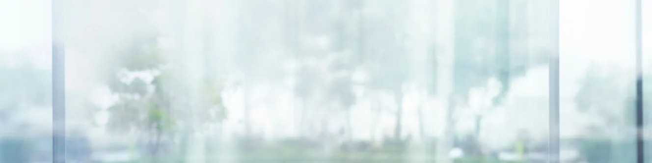 Blurred images of glass wall with city town background.modern abstract window for banner design